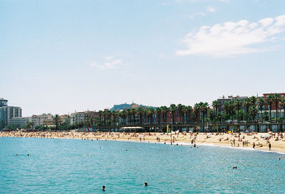 View of swimming pool by sea against sky