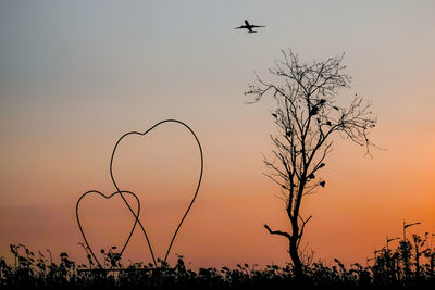 Silhouette of tree against sky during sunset