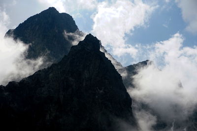 View of rock mountains amidst smoke