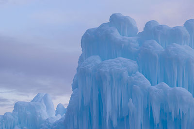 Panoramic view of snow  ice castles against sky