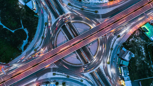 Aerial view of illuminated highways at night