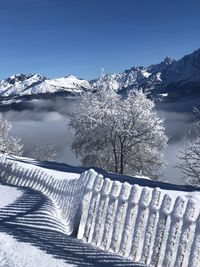 Scenic view of snow covered mountains against sky