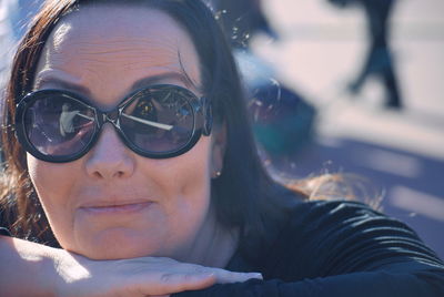 Close-up portrait of woman wearing sunglasses