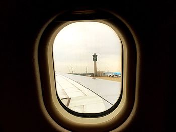 Airplane wing seen through airplane window