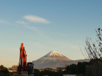 View of industry against cloudy sky