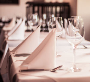 Close-up of wineglasses on table