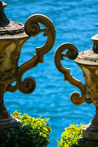 Close-up of metal sculpture by river