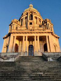 Low angle view of building against blue sky