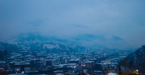 High angle view of townscape by snowfall