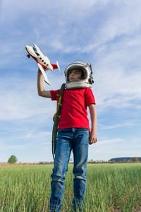 Full length of a boy standing on field