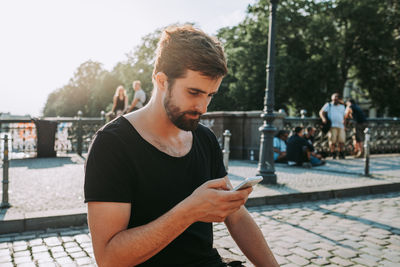 Young man using mobile phone
