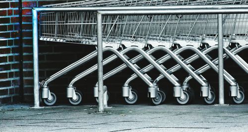 Shopping carts against brick wall