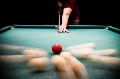 Person playing pool ball
