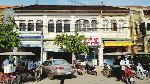 Vehicles parked by building