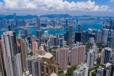 Aerial view of modern buildings in city against sky