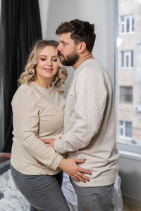 Serene couple embracing at home