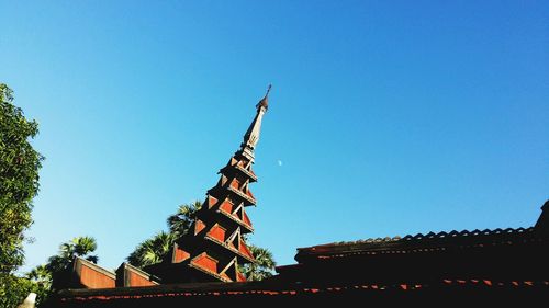 Low angle view of built structure against clear blue sky