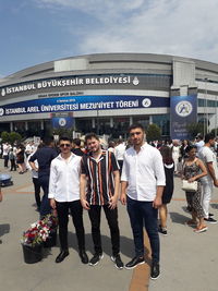 Group of people walking in front of building