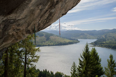 Scenic view of lake and mountains against sky