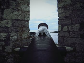 Low section of statue against sky