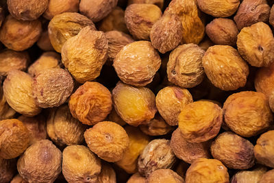 Vegan sweets - dried apricots closeup in the store.