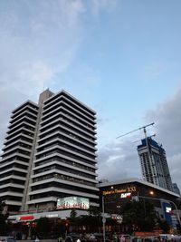 Low angle view of illuminated buildings against sky