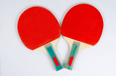 Directly above shot of heart shape on table against white background