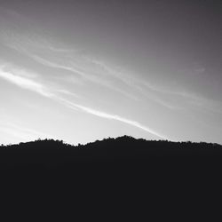 Silhouette landscape against sky
