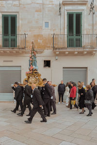Group of people walking on street