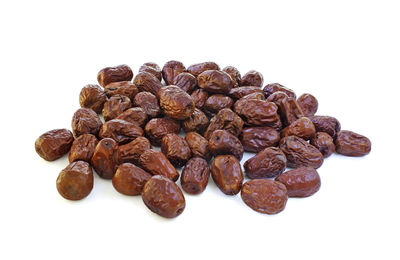 Close-up of coffee beans against white background