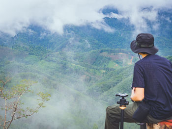 Rear view of man looking at mountain