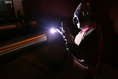 Welder welding metal in industry
