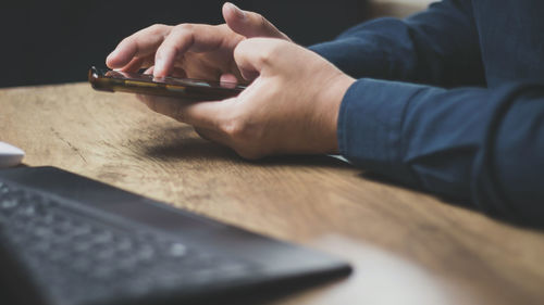 Men are using computer for social media and online marketing including working from home. 