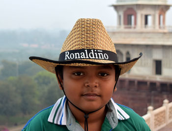 Close-up portrait of boy wearing hat