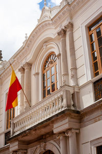 Low angle view of flags against sky