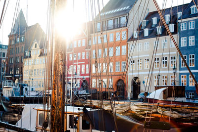 Boats moored in city