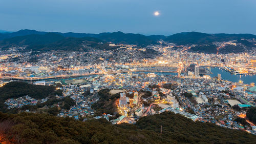 High angle view of illuminated buildings in city