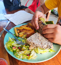 Cropped hand of person preparing food