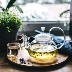 Hot herbal tea in a glass teapot
