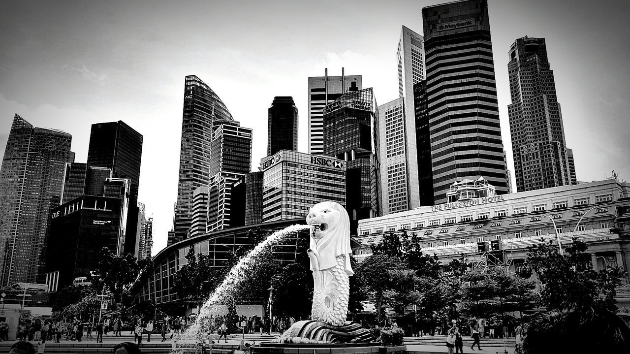 LOW ANGLE VIEW OF SKYSCRAPERS IN CITY AGAINST SKY