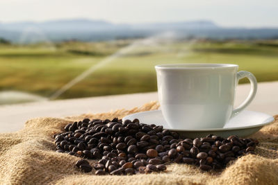 Close-up of coffee cup on table