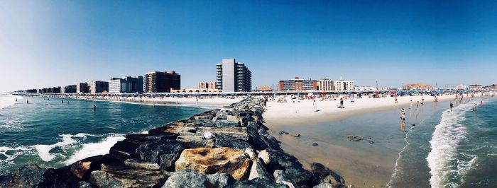 Panoramic view of sea against blue sky