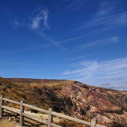 Scenic view of landscape against blue sky