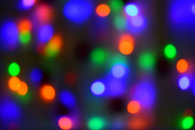 Defocused image of illuminated lights at night