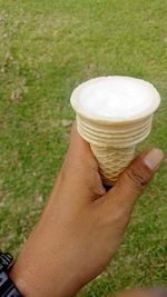 Close-up of hand holding ice cream