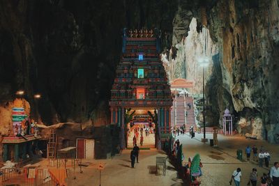 Group of people in temple outside building