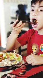 Portrait of girl eating food