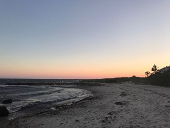 Scenic view of beach against clear sky