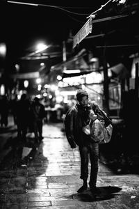 Blurred motion of people in city at night