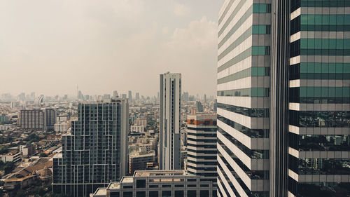 Modern buildings in city against sky